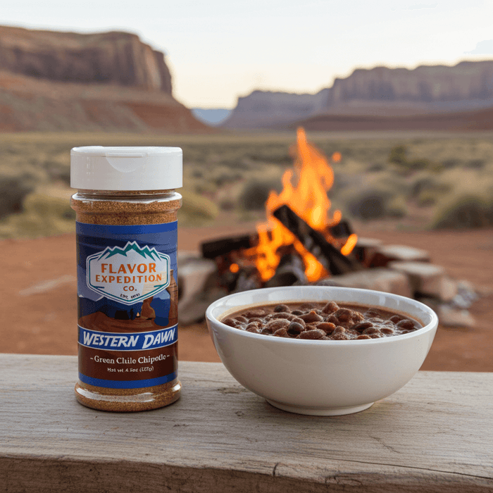 Green Chile Chipotle Seasoning by Western Dawn next to a bowl of chili by a campfire in nature.