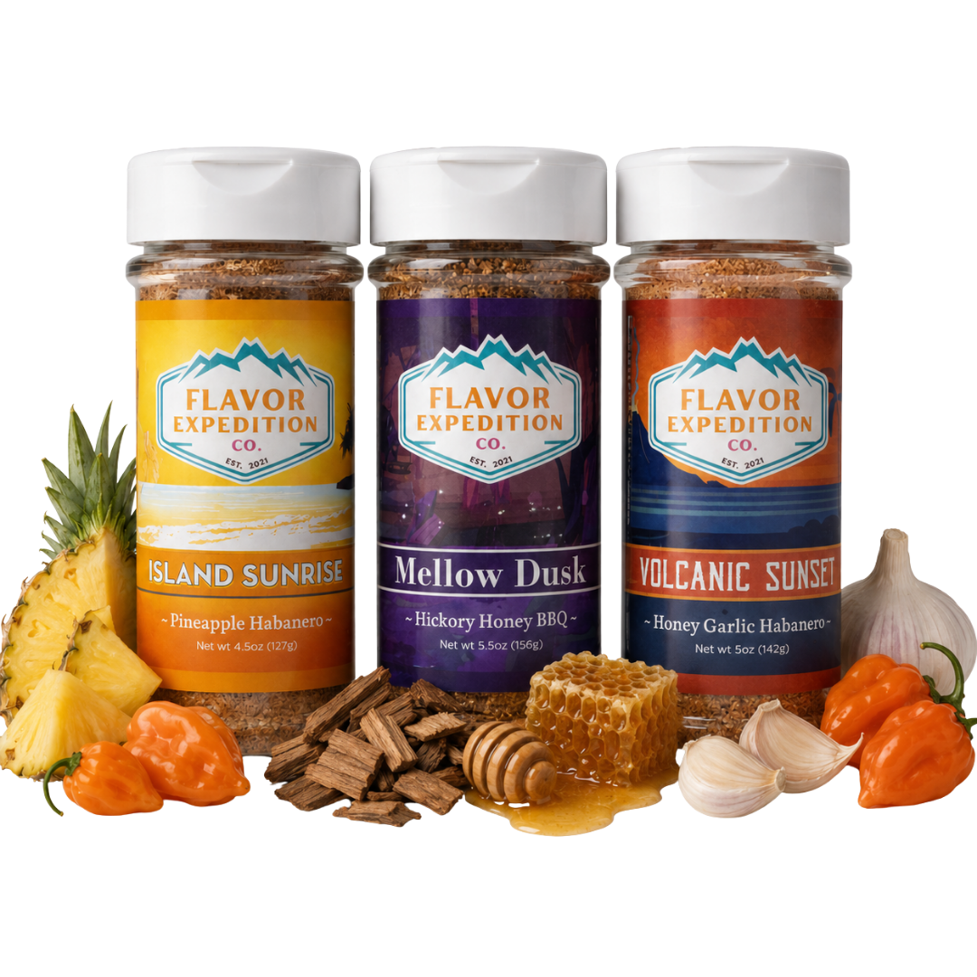 Three jars of Flavor Expedition Co. spices with ingredients like pineapple, garlic, and peppers on a white background.