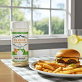 Flavor Expedition seasoning bottle with a burger and fries on a table by a window