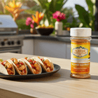 Pineapple Habanero Seasoning - Island Sunrise beside shrimp tacos in a sunny outdoor kitchen setting.