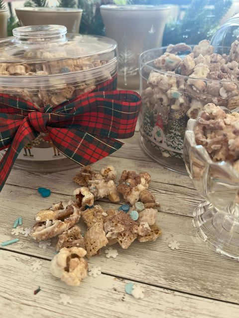 Delicious holiday popcorn in festive jars with a plaid ribbon, perfect for seasonal gatherings and treats.