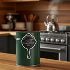 Cast Iron Sticker on a green canister in a cozy kitchen, showcasing adventure and flavor.