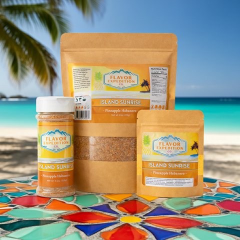 Pineapple Habanero Seasoning products from Flavor Expedition on a colorful table by the beach.